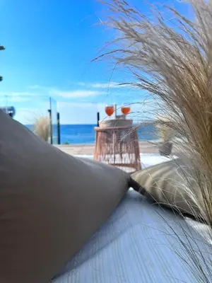 a close up of a surfboard with grass on the beach at Villa Vriko in Agia Marina Nea Kydonias