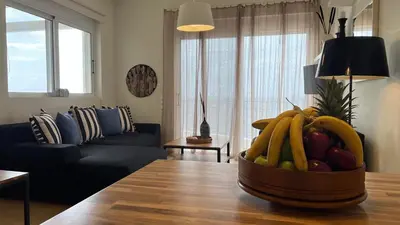 a bowl of fruit on a table in a living room at What a View Villa - Amazing Sea & Sunset Panorama with Pool in Chania Town