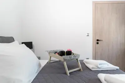 a bedroom with a bed and a table with cups on it at Peggy's house by 8essentially in Chania Town