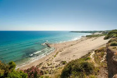 a view of a beach from a cliff at Paradisos in Frangokastello