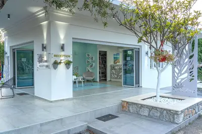 a house with a tree in a courtyard at Paradisos in Frangokastello
