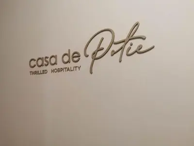 a sign that reads casico de bite with a white background at Casa De Potie in Chania Town