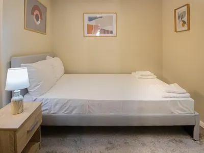a bed in a room with a nightstand and a bed sidx sidx sidx sidx at Ydragogeio Rooms Old Town in Chania Town