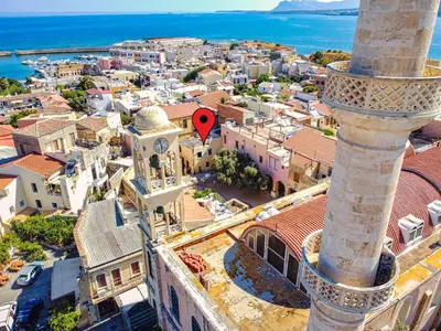 an aerial view of a town with a clock tower at Ydragogeio Rooms Old Town in Chania Town