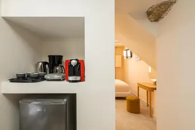 a room with a coffee maker on a counter at Ydragogeio Rooms Old Town in Chania Town