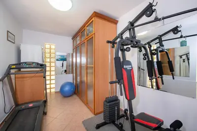 a room with a gym with a treadmill at Luxury Seaside Villa Plumeria ,50m to Sandy Beach, Chania in Tersanas