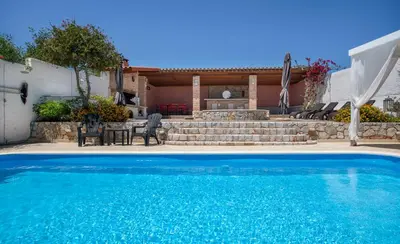 a swimming pool in front of a house at Luxury Seaside Villa Plumeria ,50m to Sandy Beach, Chania in Tersanas