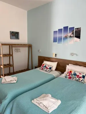 two beds sitting next to each other in a room at Milos Alexandra Studio in Frangokastello