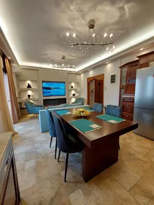 a kitchen and dining room with a table and chairs at Rika's Sea View Apartment in Chania Town