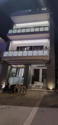 a building with a bike parked in front of it at Rika's Sea View Apartment in Chania Town