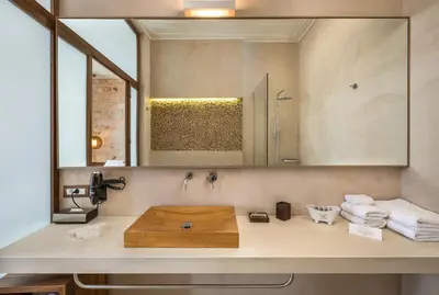 a bathroom with a sink and a mirror at Ambassadors Residence Boutique Hotel in Chania Town