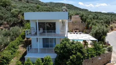 an aerial view of a house on a hill at Freya's Royal Estate, Kissamos in Khairethianá