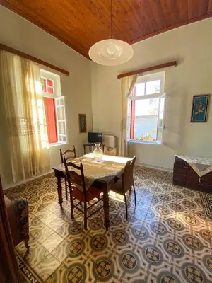 a dining room with a table and chairs at THE NEOCLASSICAL Garden House in Chania Town