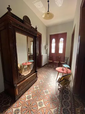 a room with two tables and a large mirror at THE NEOCLASSICAL Garden House in Chania Town