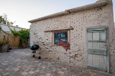 a brick building with a camera next to a window at Meraki Cretan Hospitality in Maleme