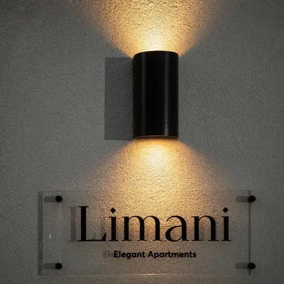 a light hanging from the ceiling of a room at Limani elegant apartments in Souda
