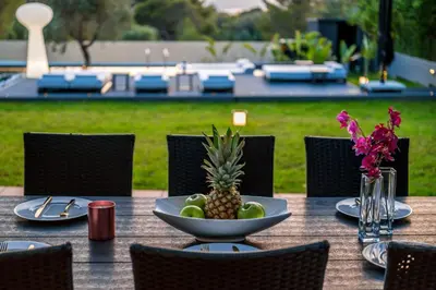 a table with a bowl of fruit on top of it at Chania lux villa with Heated pool in Chania Town