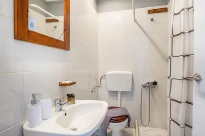 a bathroom with a sink and a toilet at Sun Beach Apartments in Chania 8 &10& 13 in Chania Town