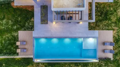 an overhead view of a house with a swimming pool at ISKIOS Premium in Agia Marina Nea Kydonias