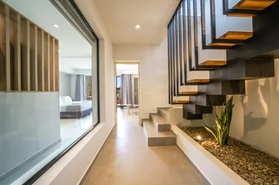 a staircase in a house with a living room at ISKIOS Premium in Agia Marina Nea Kydonias