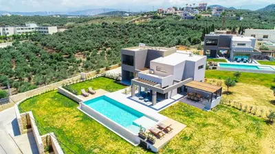 an aerial view of a house with a swimming pool at ISKIOS Premium in Agia Marina Nea Kydonias