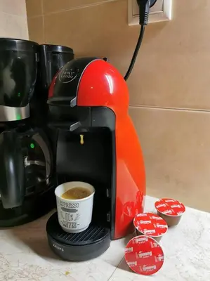 a coffee maker sitting on a counter with a cup of coffee at Comfy APT in Chania City Center in Chania Town