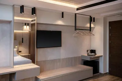 a living room with a flat screen tv on a wall at Casa Dorini in Chania Town