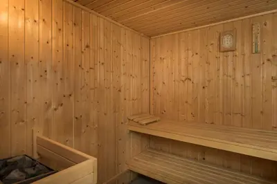 a wooden sauna with a wooden bench in it at Iason Villas – Chania, Crete in Maleme