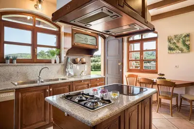 a kitchen with a sink and a stove top oven at Iason Villas – Chania, Crete in Maleme