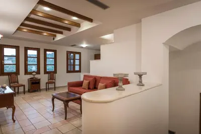 a living room with a couch and a table at Iason Villas – Chania, Crete in Maleme