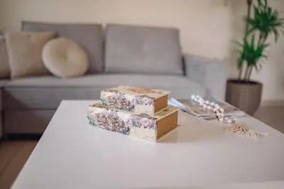 a group of boxes sitting on a table in a living room at Helen Sweet Home in Kounoupidhianá