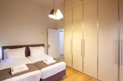 a bedroom with a bed and a closet at Cactus Residence Chania in Chania Town