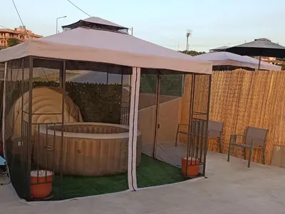a gazebo with a pool inside of it at Vrachakia Stylish in Ayiá