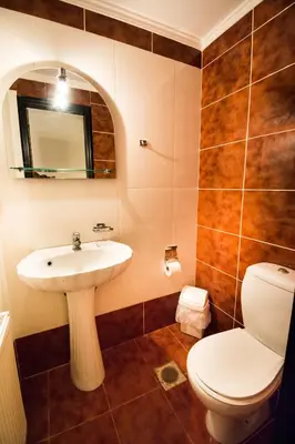 a bathroom with a sink and a toilet at Electra's House in Chania Town