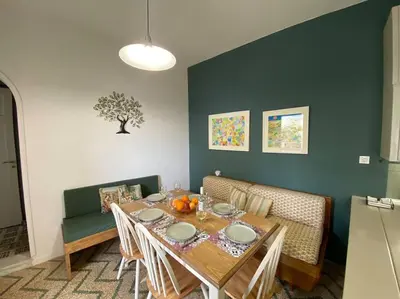a dining room with a table and chairs at Efi’s House in Chania Town