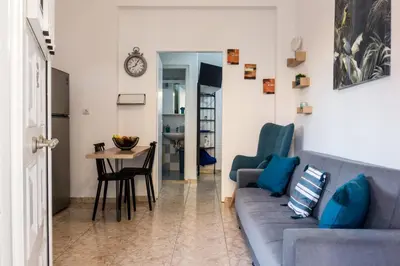 a living room with a couch and a table at Zilina Homes2 in Chania Town