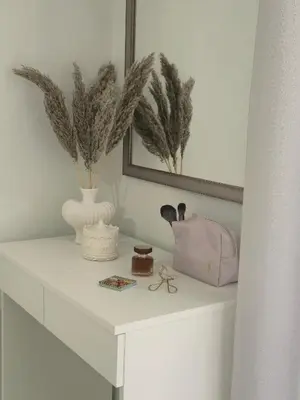 a white table with a vase and a purse on it at Idene Penthouse in Chania Town