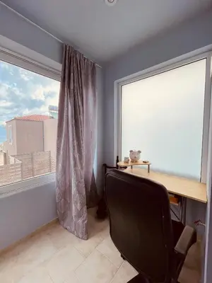 a room with a desk and a large window at Selini Seaview Villa in Kissamos