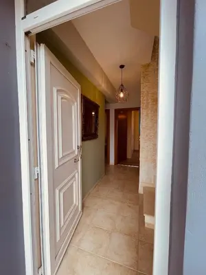 an empty hallway with a door and a tile floor at Selini Seaview Villa in Kissamos