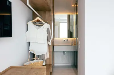 a bathroom with a sink and a mirror at Heniochos Villas in Chania Town