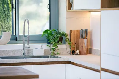 a kitchen with a sink and a window at Heniochos Villas in Chania Town