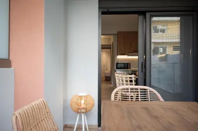 a dining room with a table and two chairs at Anassa Seaside Residence- 50m from Sandy Beach in Chania Town