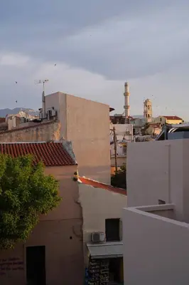 a view of roofs of buildings in a city at Venetian Owl, 1min To Lighthouse in Chania Town