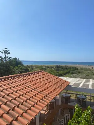 a roof of a building with a table and chairs at Artemis Hotel-MeRaki Restaurant in Frangokastello