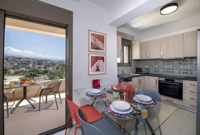 a kitchen and dining room with a table and chairs at Α Ηeaven View Park Gem - Chania Getaway in Chania Town