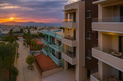 an apartment building with a sunset in the background at Α Ηeaven View Park Gem - Chania Getaway in Chania Town