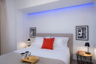 a bedroom with a bed with a tray of food on it at Α Ηeaven View Park Gem - Chania Getaway in Chania Town