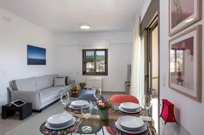 a living room with a couch and a table at Α Ηeaven View Park Gem - Chania Getaway in Chania Town