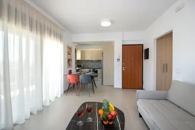 a living room with a couch and a table with fruit on it at Α Ηeaven View Park Gem - Chania Getaway in Chania Town