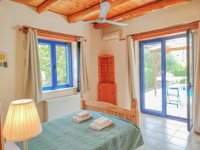 a bedroom with a bed with two towels on it at Lemon Tree Villa with Private Pool and Starlink Internet in Frés